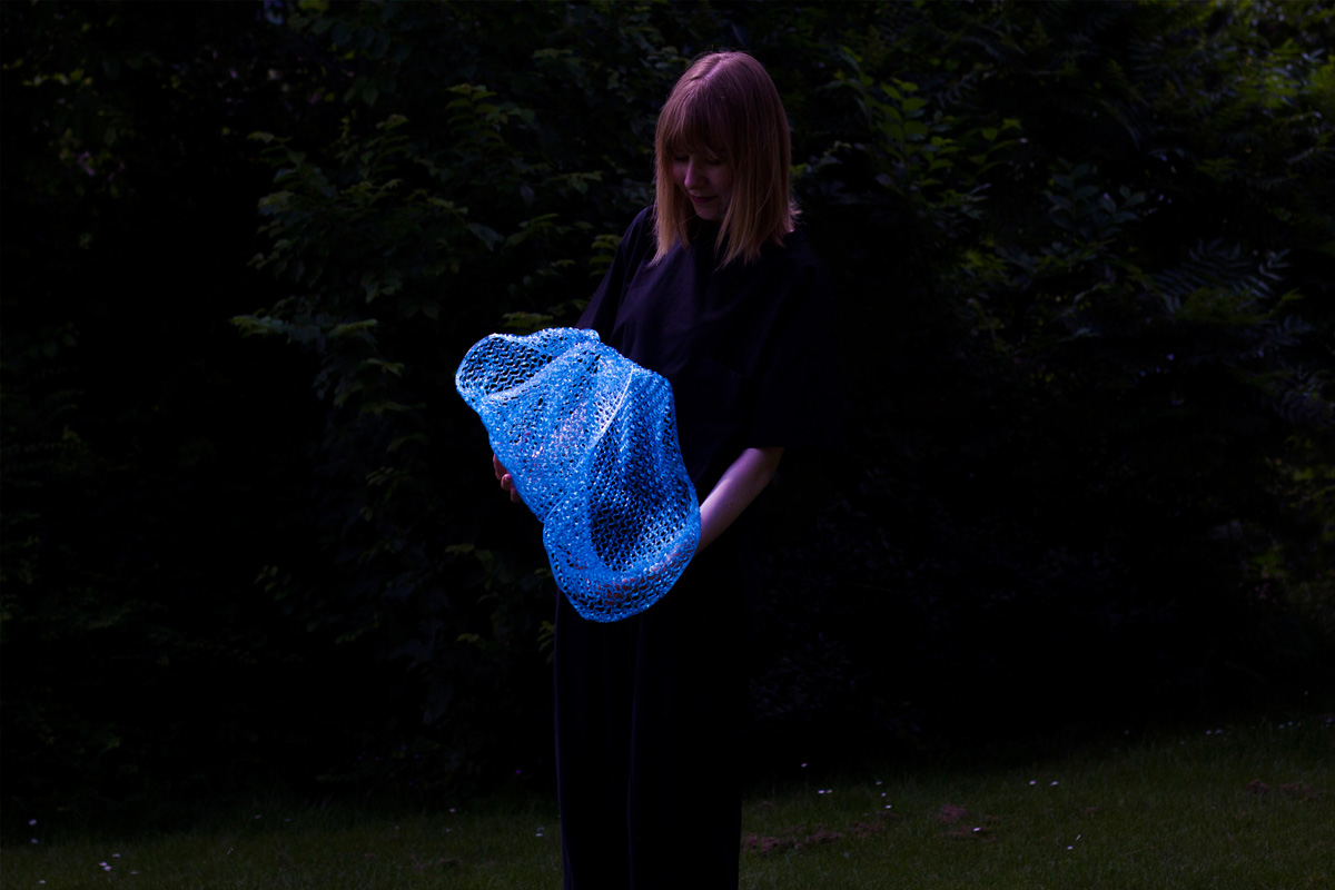 photograph of woman holding portal
