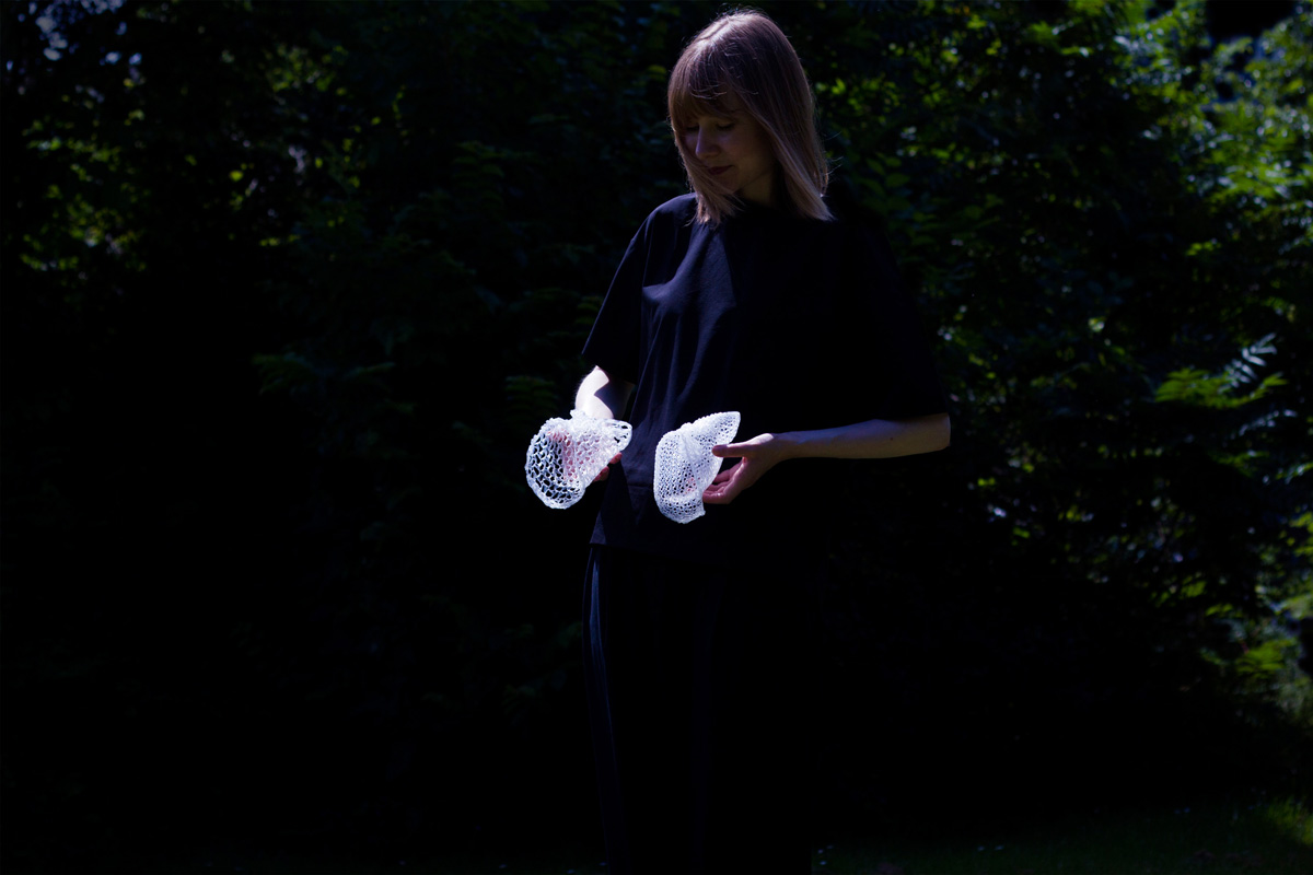 photograph of woman holding two portals