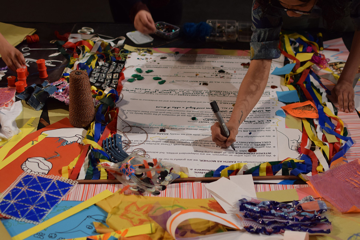 several hands working together on the Planet Abundance manifesto